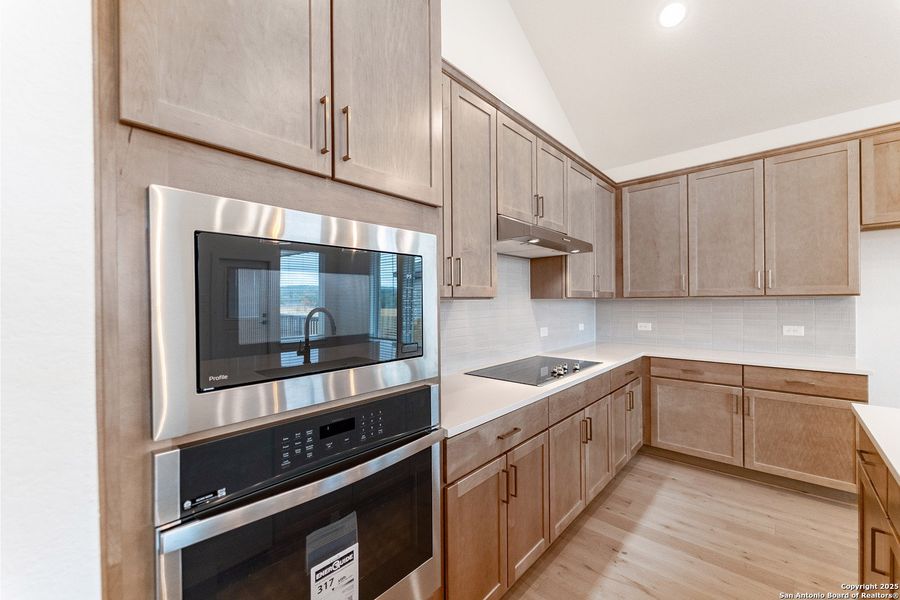 Furnished interior view inside a new home in The Woodlands at Medina Hills, Mico (Image 9).