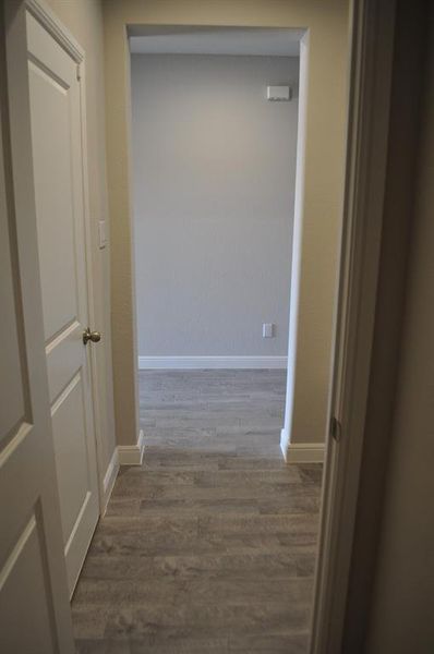 Hall featuring dark hardwood / wood-style flooring