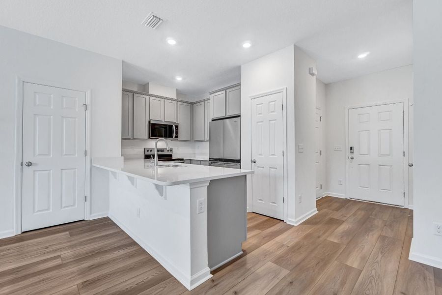 Furnished interior view inside a new home in Orchard Park Townhomes, St. Augustine (Image 7).