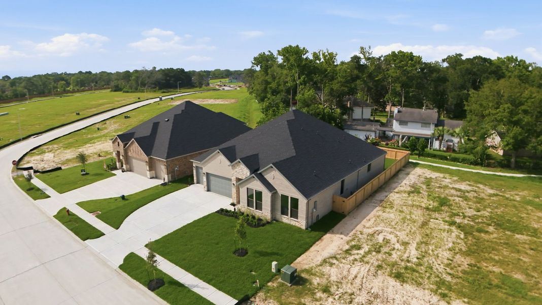 Front exterior of a new home in Friendswood Trails 70' Homesites, Friendswood, TX, highlighting curb appeal (Image 25).