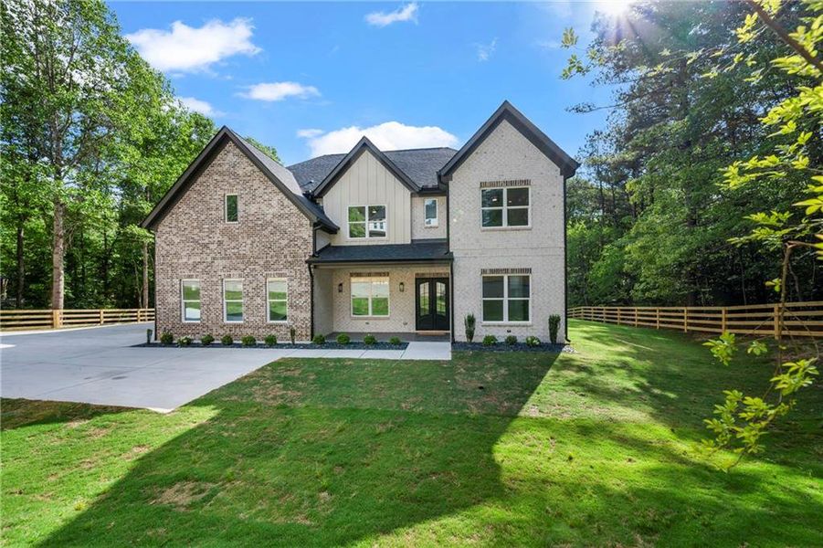 Front exterior of a new home in , Dacula, GA, highlighting curb appeal (Image 31). Front exterior of a new home in , Dacula, GA, highlighting curb appeal (Image 31).