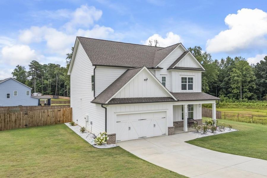 Front exterior of a new home in , Winder, GA, highlighting curb appeal (Image 31).