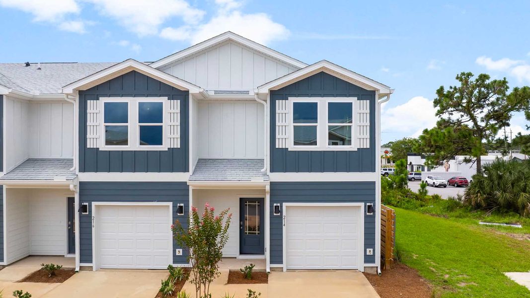 Front exterior of a new home in Caballeros Estates Townhomes at Hombre, Panama City Beach, FL, highlighting curb appeal (Image 2). Front exterior of a new home in Caballeros Estates Townhomes at Hombre, Panama City Beach, FL, highlighting curb appeal (Image 2).