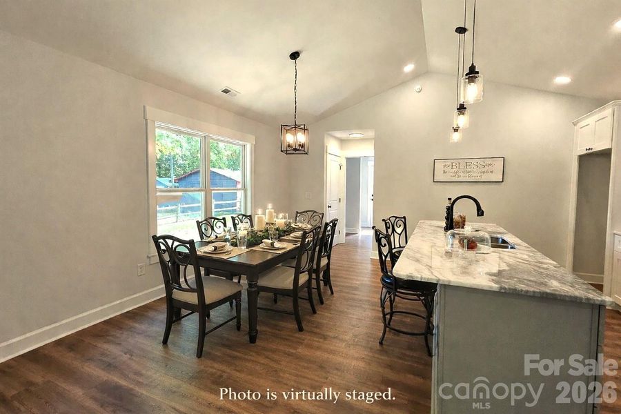 Table is virtually staged. Lots of dining options with large island that seats 4 & Dining area. Great for entertaining.