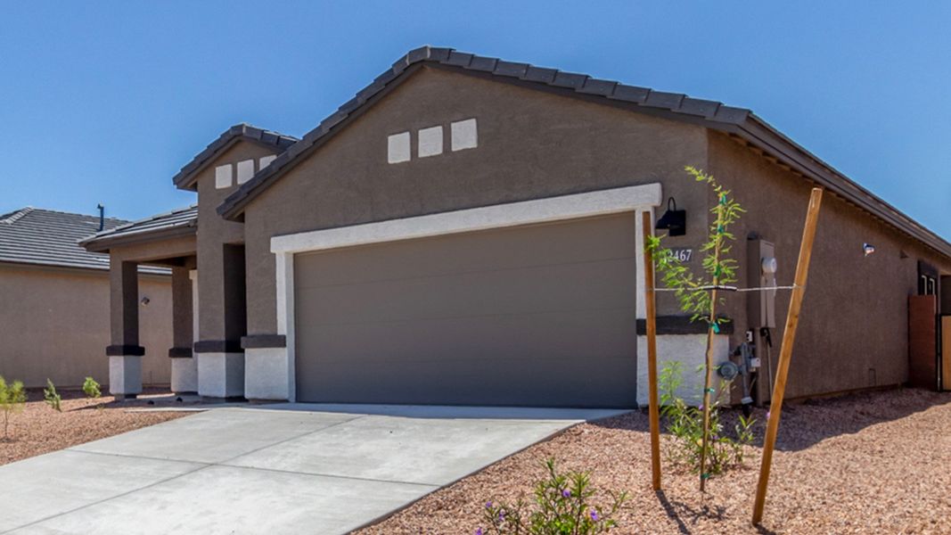 Front exterior of a new home in Barnett Village, Marana, AZ, highlighting curb appeal (Image 27).