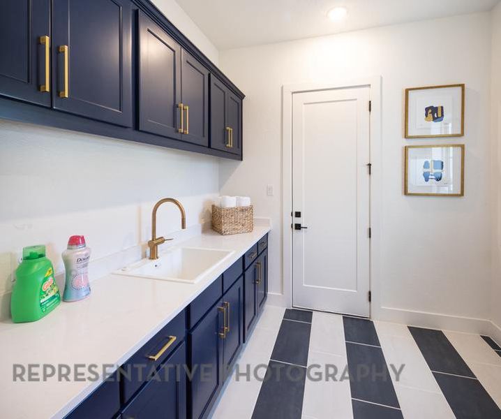 Clothes washing area featuring recessed lighting, light tile patterned floors, baseboards, and a sink Clothes washing area featuring recessed lighting, light tile patterned floors, baseboards, and a sink