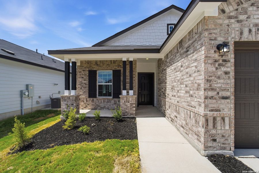 Exterior details and patio area of a home in Mesa Vista, Von Ormy (Image 3).