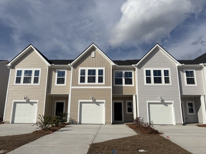 Front exterior of a new home in Lindera Preserve at Cane Bay Plantation, Summerville, SC, highlighting curb appeal (Image 1). Front exterior of a new home in Lindera Preserve at Cane Bay Plantation, Summerville, SC, highlighting curb appeal (Image 1).