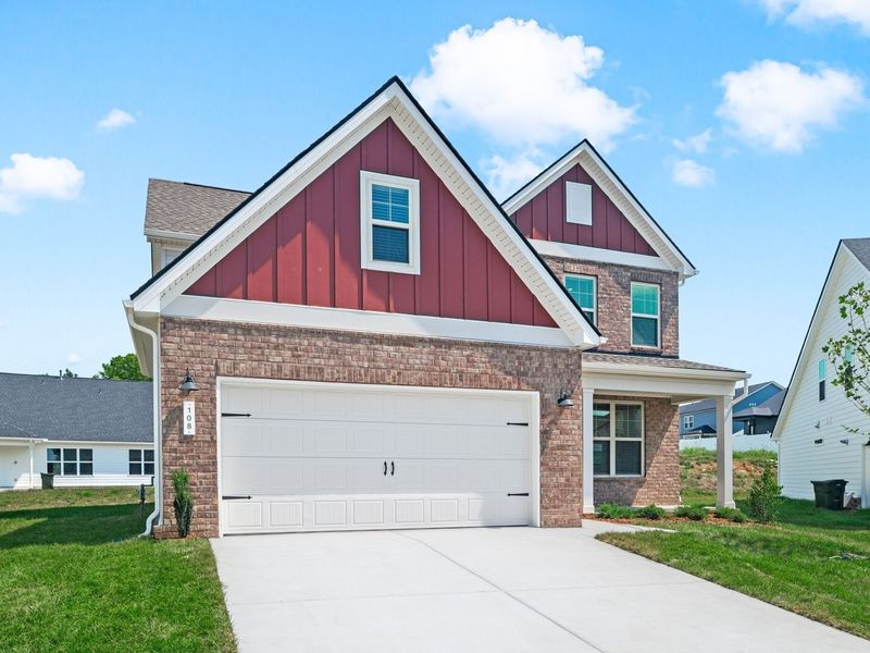 Front exterior of a new home in Woods Crossing, Gallatin, TN, highlighting curb appeal (Image 29).