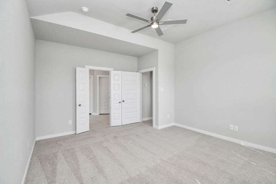 Escape and relax in the exquisite primary suite, a haven to unwind after a long day. The spacious room, boasts plush carpeting, soothing paint tones, high ceilings, and expansive windows adorned with privacy blinds. Sample photo of completed home with similar floor plan. Actual colors and selections may vary. Escape and relax in the exquisite primary suite, a haven to unwind after a long day. The spacious room, boasts plush carpeting, soothing paint tones, high ceilings, and expansive windows adorned with privacy blinds. Sample photo of completed home with similar floor plan. Actual colors and selections may vary.