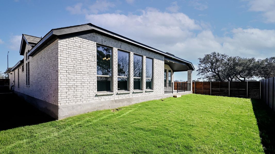 Exterior details and patio area of a home in Juniper Springs, Lockhart (Image 25).