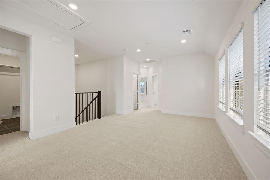 Upstairs you'll find a spacious game room that is the perfect place for additional family fun time. Upstairs you'll find a spacious game room that is the perfect place for additional family fun time.