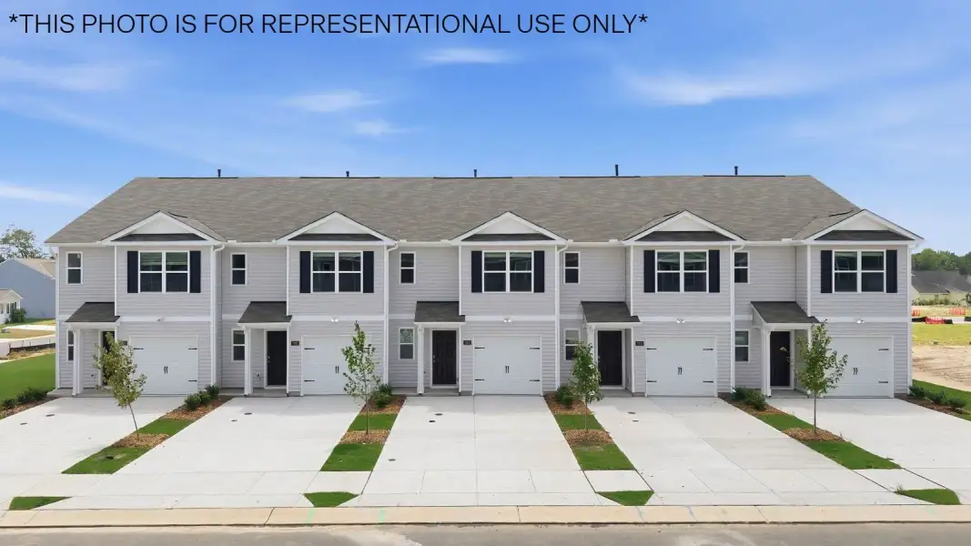 Front exterior of a new home in The Townes at Hunter Hill, Rocky Mount, NC, highlighting curb appeal (Image 1). Front exterior of a new home in The Townes at Hunter Hill, Rocky Mount, NC, highlighting curb appeal (Image 1).