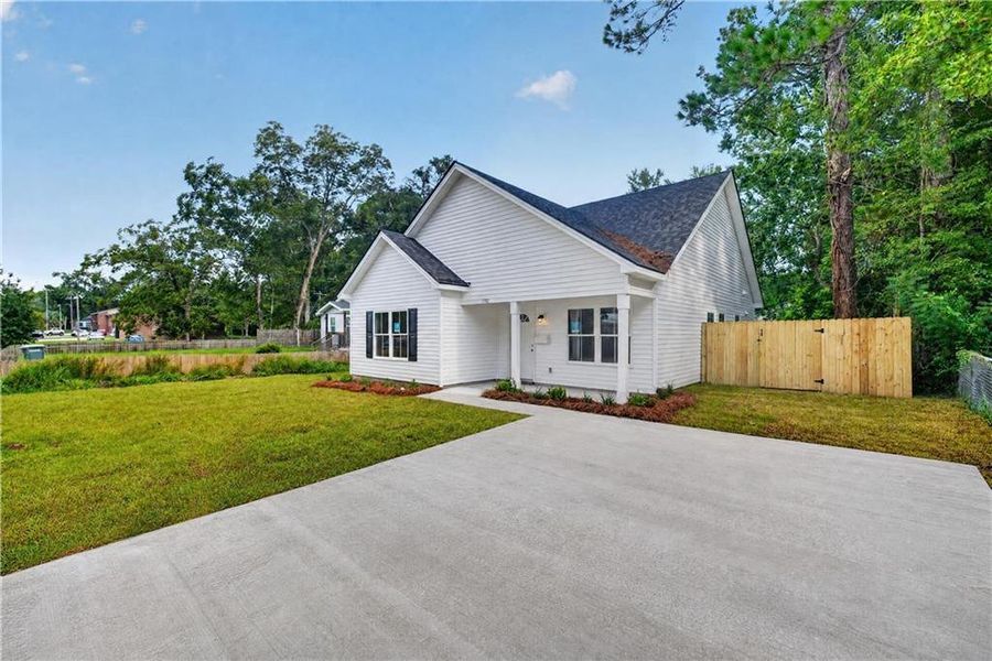 Front exterior of a new home in , Savannah, GA, highlighting curb appeal (Image 2). Front exterior of a new home in , Savannah, GA, highlighting curb appeal (Image 2).