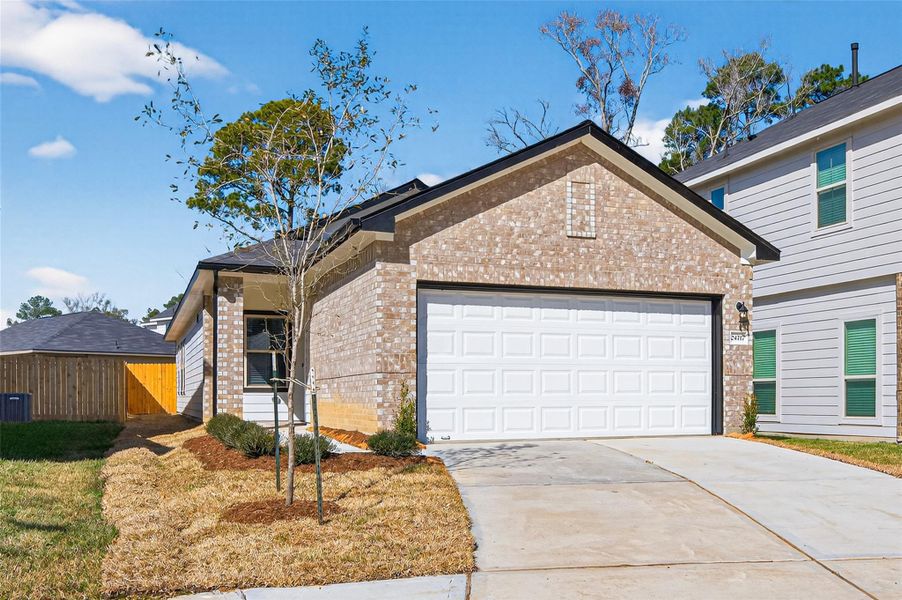 Front exterior of a new home in Woodland Lakes, Houston, TX, highlighting curb appeal (Image 20).