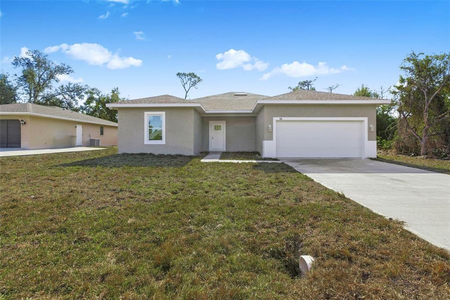 Front exterior of a new home in , Port Charlotte, FL, highlighting curb appeal (Image 25).