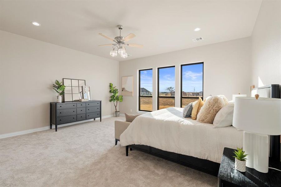 Bedroom with access to outside, light colored carpet, and ceiling fan