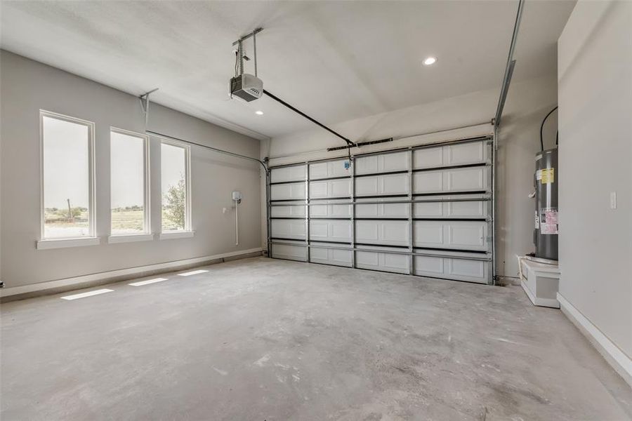 Garage with a garage door opener and water heater