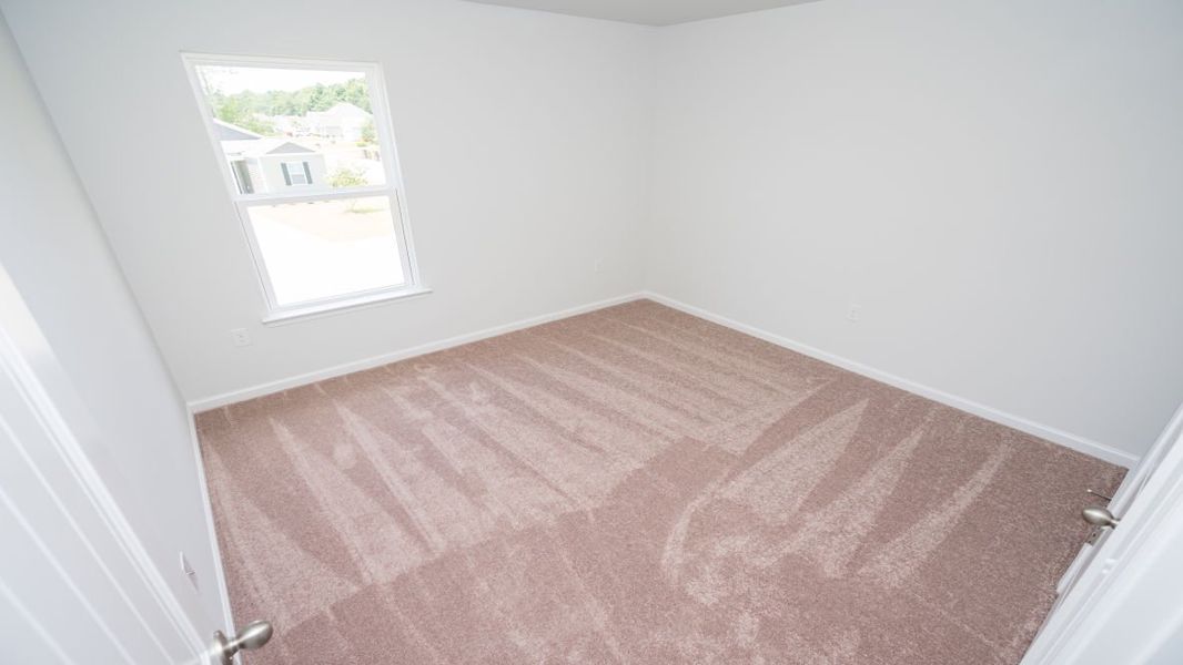 Representative unfurnished interior of a home built from the ROBIE by D.R. Horton in Indigo Preserve, Leland (Image 29).