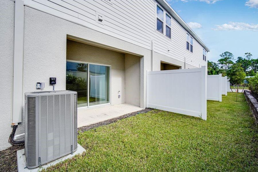 Exterior details and patio area of a home in The Townhomes at Skye Ranch, Sarasota (Image 25).
