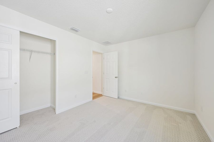 Spacious, unfurnished interior of a new home in Somerset - Executive Series, Palm Coast (Image 14). Spacious, unfurnished interior of a new home in Somerset - Executive Series, Palm Coast (Image 14).