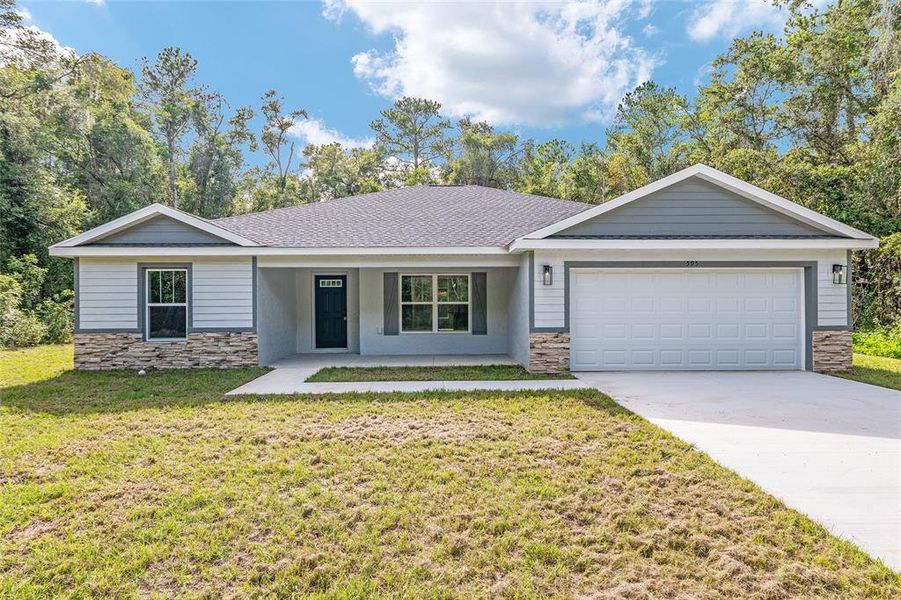 Front exterior of a new home in , Dunnellon, FL, highlighting curb appeal (Image 22).