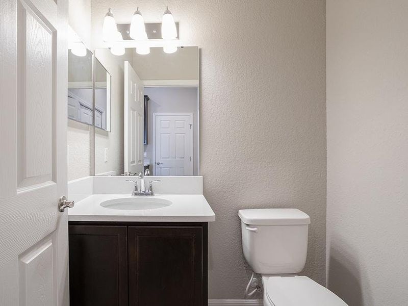 And, a downstairs powder room serves your guests - Brynn bungalow by Highland Homes