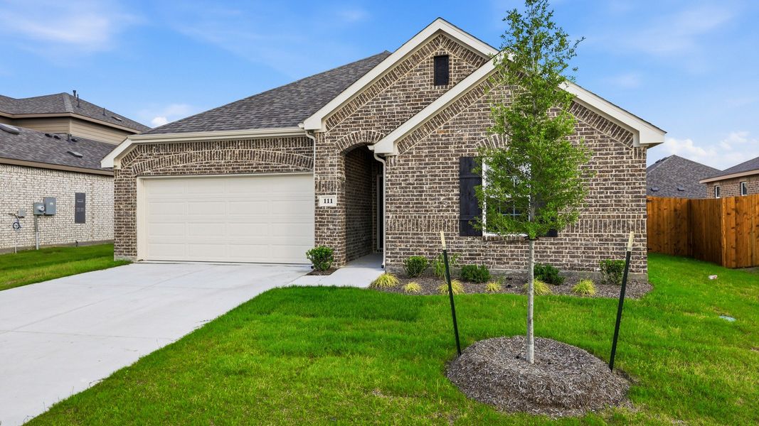 Front exterior of a new home in Patriot Estates, Venus, TX, highlighting curb appeal (Image 21).