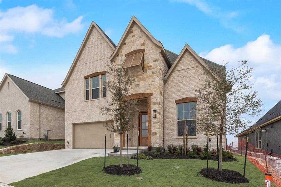 Front exterior of a new home in Hillside Village, Celina, TX, highlighting curb appeal (Image 26).