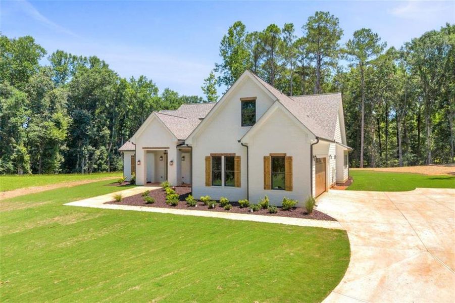 Front exterior of a new home in , Monroe, GA, highlighting curb appeal (Image 28). Front exterior of a new home in , Monroe, GA, highlighting curb appeal (Image 28).