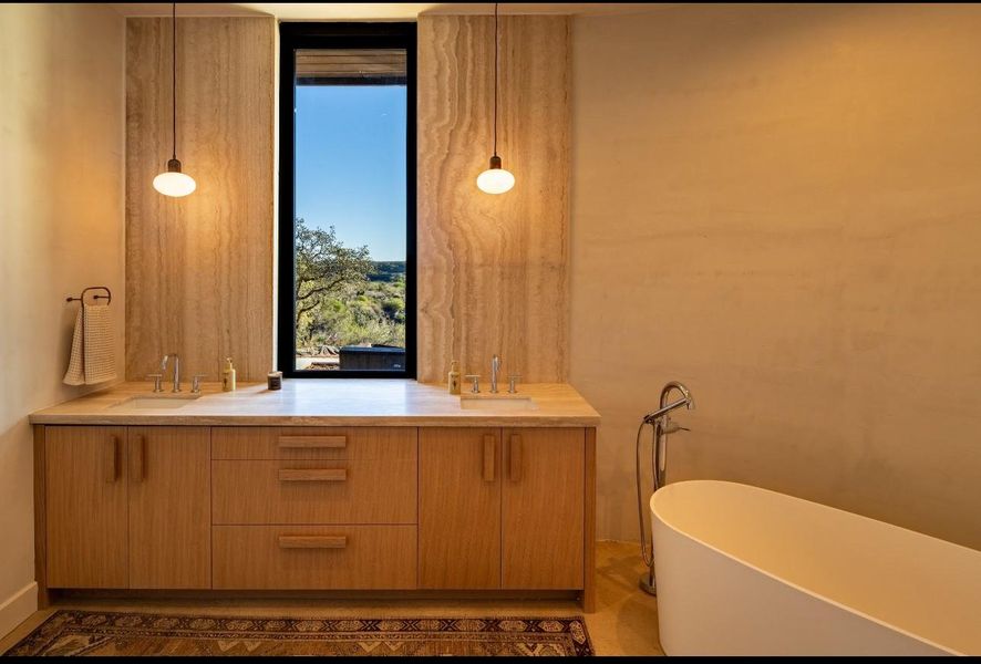 Bathroom with double vanity and a freestanding bath