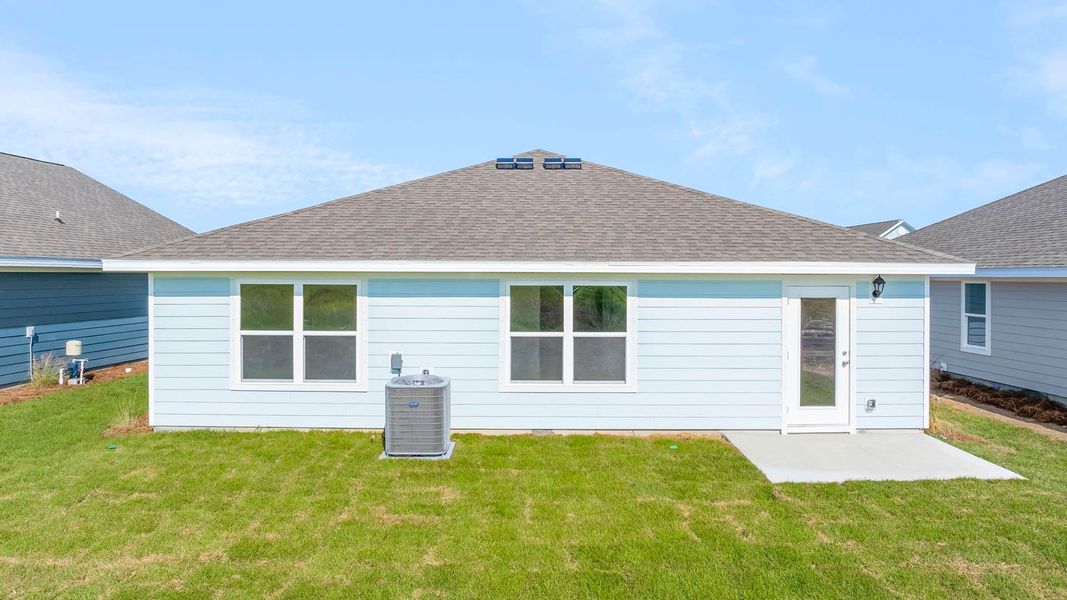 Front exterior of a new home in Owl's Head Farms, Freeport, FL, highlighting curb appeal (Image 17). Front exterior of a new home in Owl's Head Farms, Freeport, FL, highlighting curb appeal (Image 17).