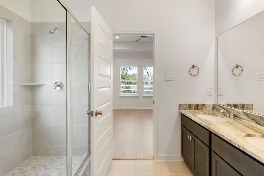 Enjoy a spacious walk-in shower in the primary bathroom, perfect for daily relaxation.