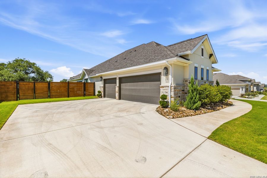Front exterior of a new home in Megan's Landing, Castroville, TX, highlighting curb appeal (Image 23). Front exterior of a new home in Megan's Landing, Castroville, TX, highlighting curb appeal (Image 23).