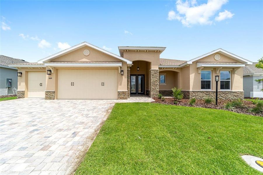 Front exterior of a new home in On Top of the World Communities, Ocala, FL, highlighting curb appeal (Image 21).