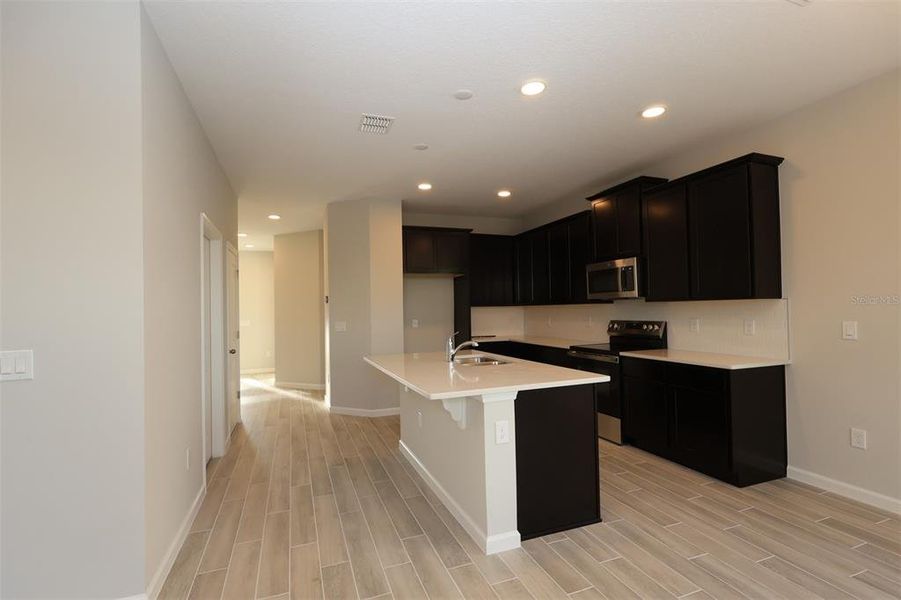 Furnished interior view inside a new home in Tribute at Ovation, Winter Garden (Image 6).