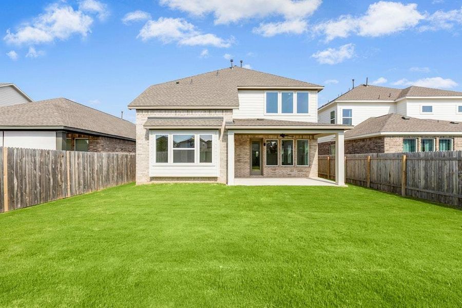 Front exterior of a new home in Santa Rita Ranch, Liberty Hill, TX, highlighting curb appeal (Image 20). Front exterior of a new home in Santa Rita Ranch, Liberty Hill, TX, highlighting curb appeal (Image 20).