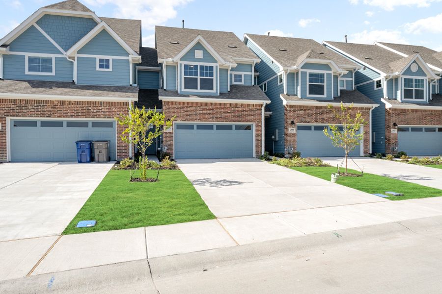 Front exterior of a new home in Woodbridge Townhomes, Wylie, TX, highlighting curb appeal (Image 26).
