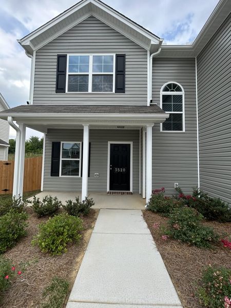 Front exterior of a new home in The Wilcox, Greensboro, NC, highlighting curb appeal (Image 27). Front exterior of a new home in The Wilcox, Greensboro, NC, highlighting curb appeal (Image 27).