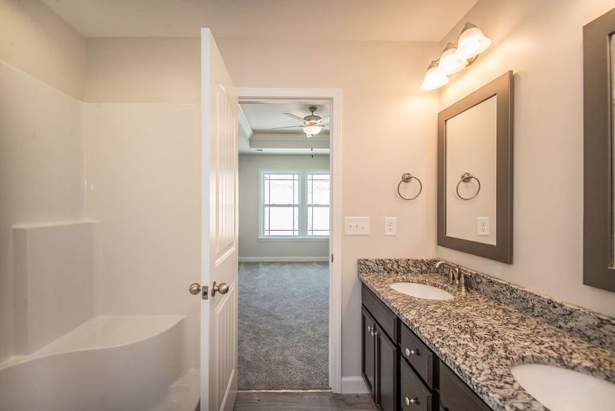 Representative furnished interior of a home built from the Quincy by Enchanted Homes in Hampshire Heights, Moore (Image 15).