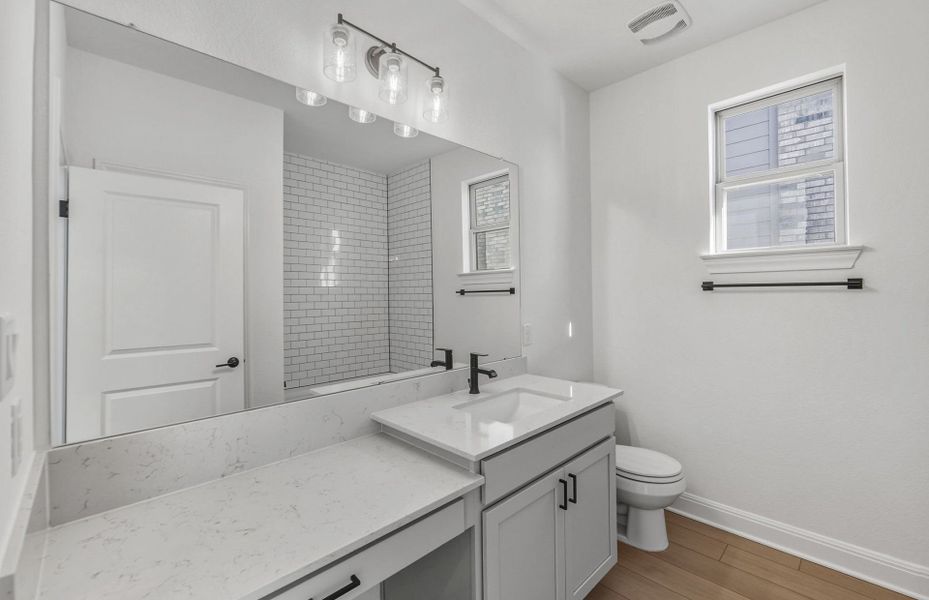 Furnished interior view inside a new home in West Cypress Hills, Spicewood (Image 10).