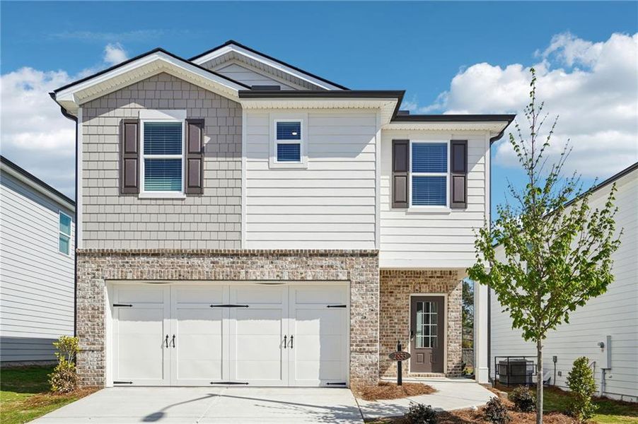 Front exterior of a new home in Hawthorne Station, College Park, GA, highlighting curb appeal (Image 24).