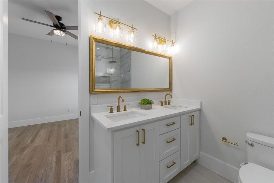Full bath featuring double vanity