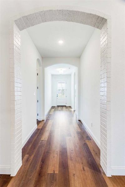 Hall with dark wood-type flooring