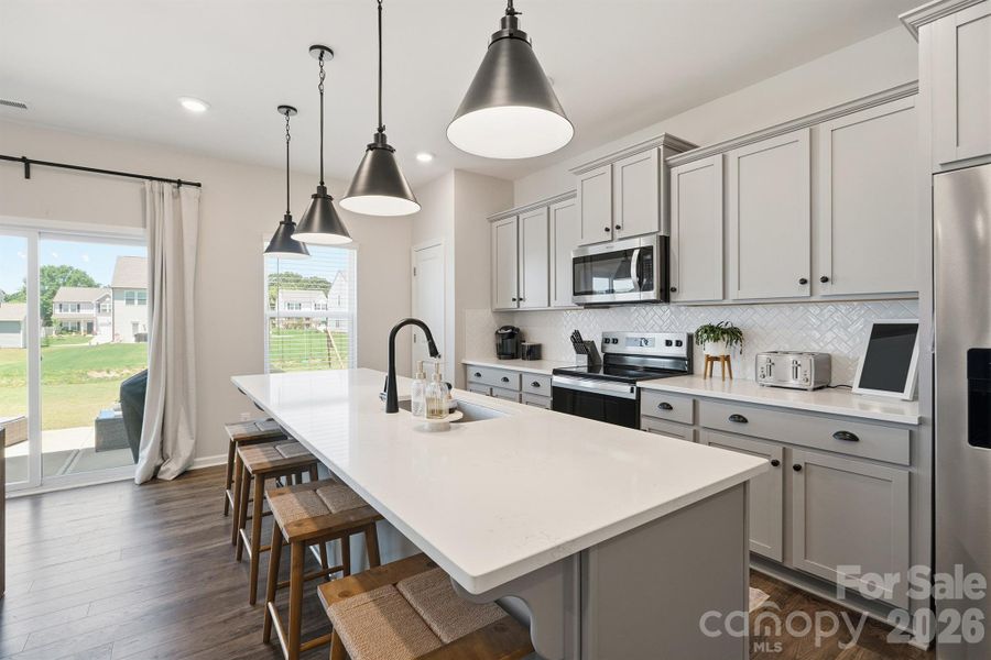 Kitchen with pantry and sliding door to patio