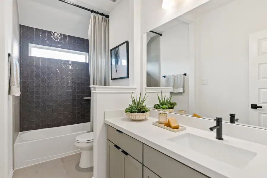 Representative furnished interior of a home built from the Premier Series - Mimosa by Brightland Homes in Anthem, Kyle (Image 28).