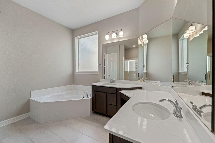 The en-suite bathroom offers a spa-like atmosphere with its elegant design, high end finishes, and tasteful lighting, creating a retreat within your own home. The en-suite bathroom offers a spa-like atmosphere with its elegant design, high end finishes, and tasteful lighting, creating a retreat within your own home.