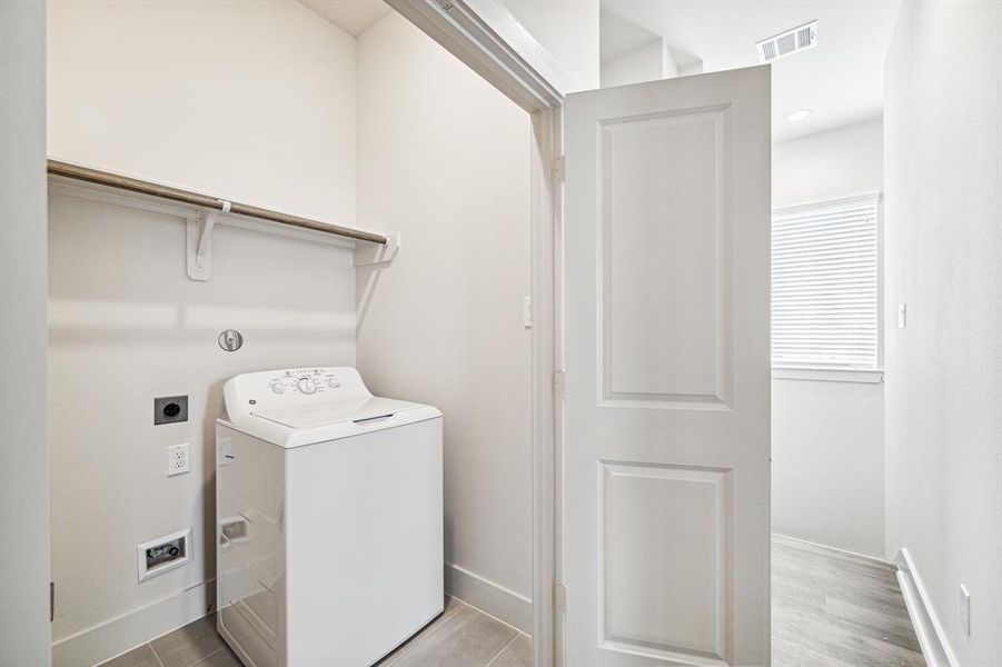 Conveniently located on the second floor by the bedroom is the laundry room that is equipped withgas or electric dryer connections.