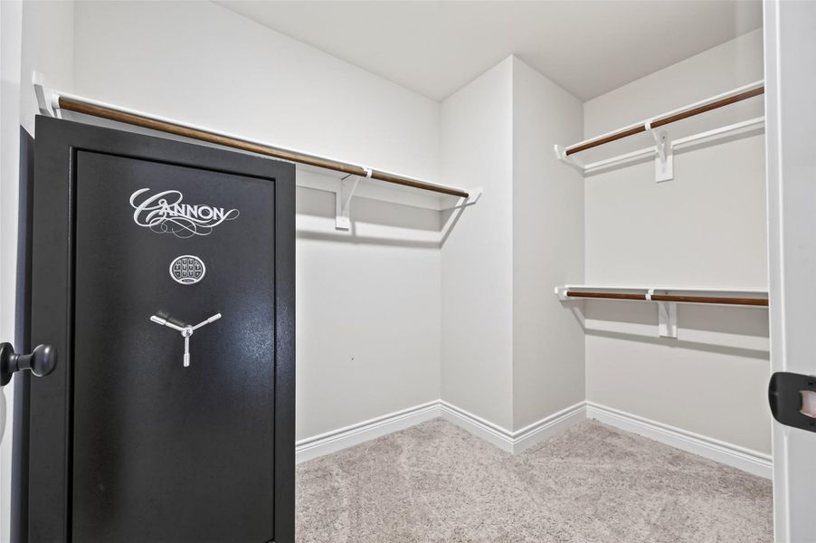 This spacious 4th bedroom walk-in closet is designed for optimal organization, featuring custom built-in shelving and extensive hanging space tailored to accommodate multiple wardrobes with ease. The layout includes a unique, reinforced dedicated section specifically engineered to house a secure safe, providing both peace of mind and premium storage functionality. This highly organized, versatile space offers the perfect blend This spacious 4th bedroom walk-in closet is designed for optimal organization, featuring custom built-in shelving and extensive hanging space tailored to accommodate multiple wardrobes with ease. The layout includes a unique, reinforced dedicated section specifically engineered to house a secure safe, providing both peace of mind and premium storage functionality. This highly organized, versatile space offers the perfect blend