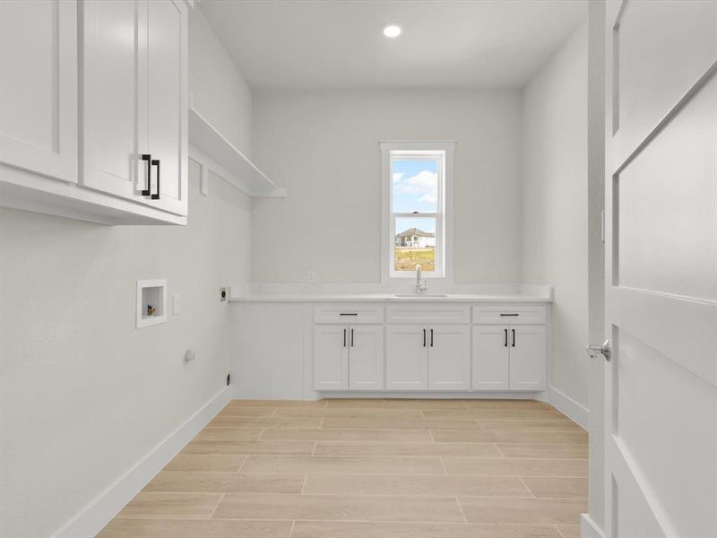 Large utility room with storage and sink